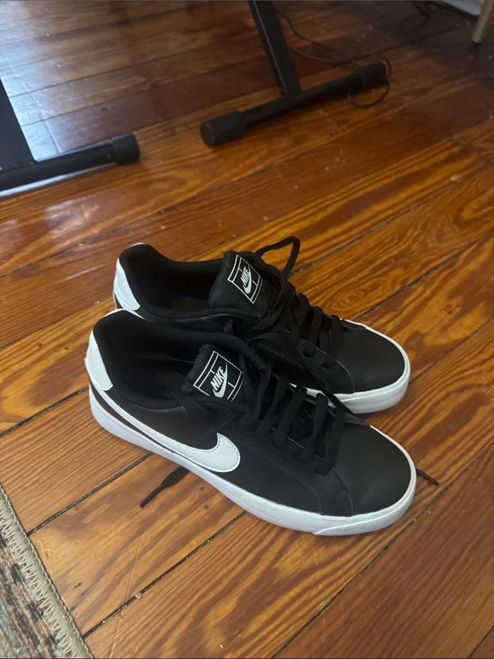 Nike Black Low-Top Sneakers with White Swoosh